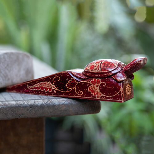 Batik-Patterned Turtle-Themed Burgundy Pule Wood Door Stop, 'Wise Advisor'